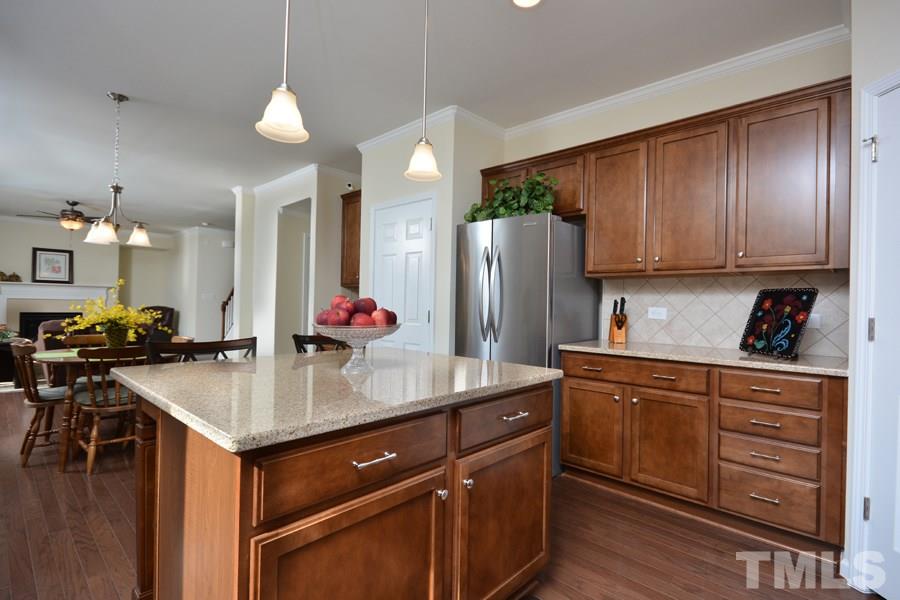 1007 Lakeview Road Durham, NC 27712 - Photo 10 of 25 a kitchen with refrigerator a sink and cabinets