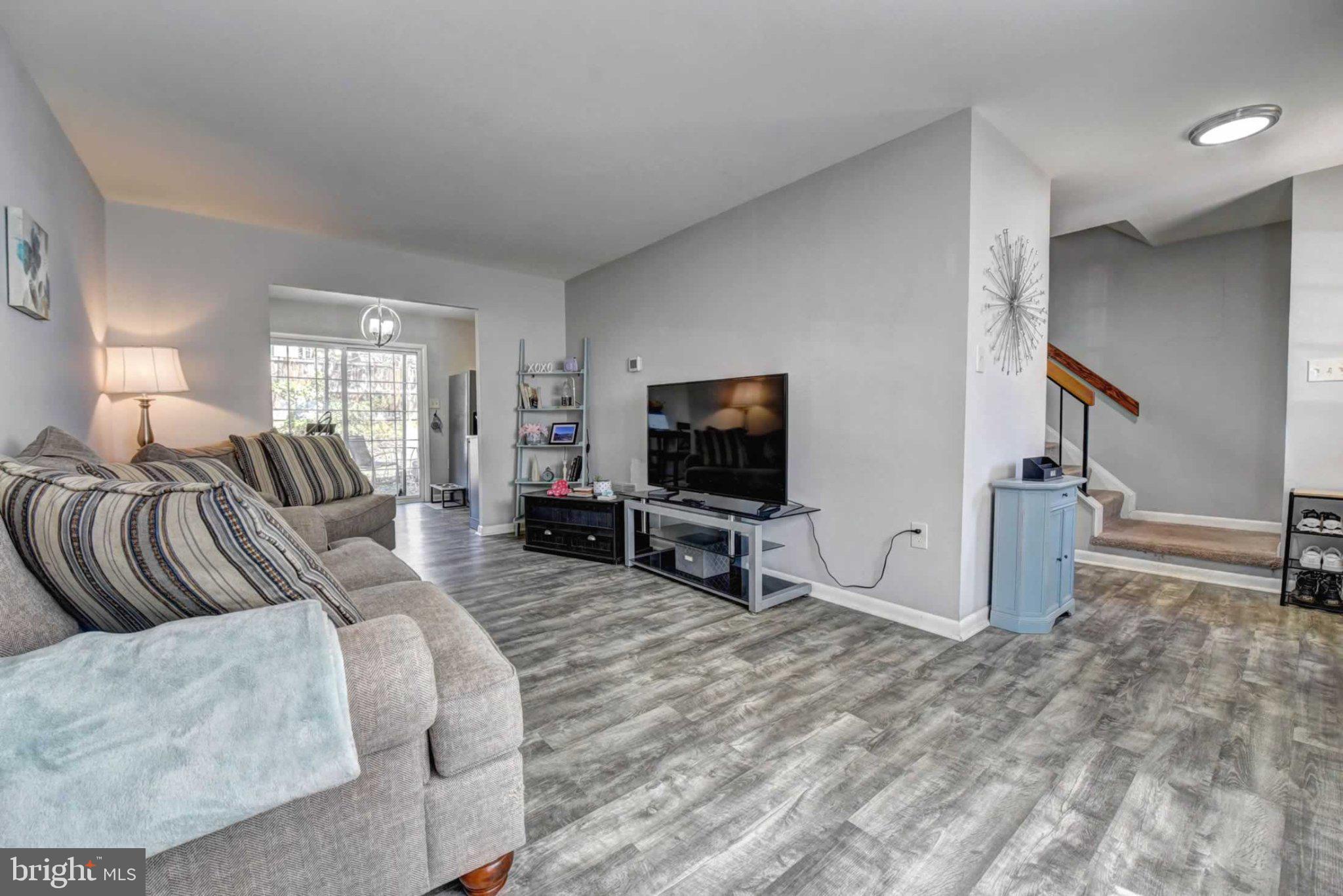 2226 Gunsmith Square Reston, VA 20191 - Photo 6 of 35 a living room with furniture and a flat screen tv