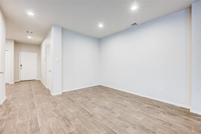 a large kitchen with stainless steel appliances granite countertop a sink stove and refrigerator