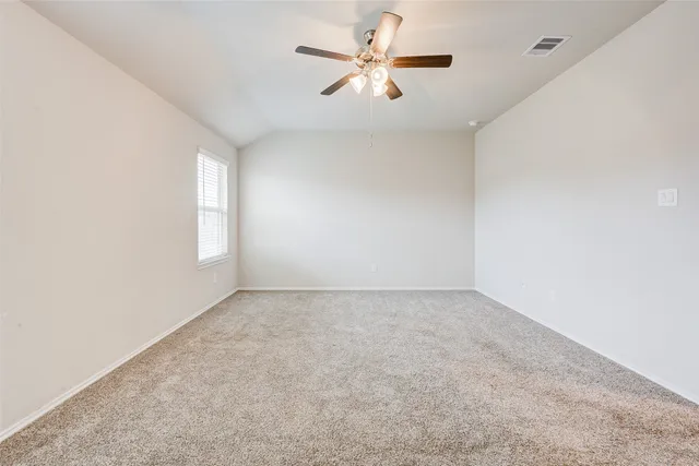 a bathroom with a tub sink shower and mirror