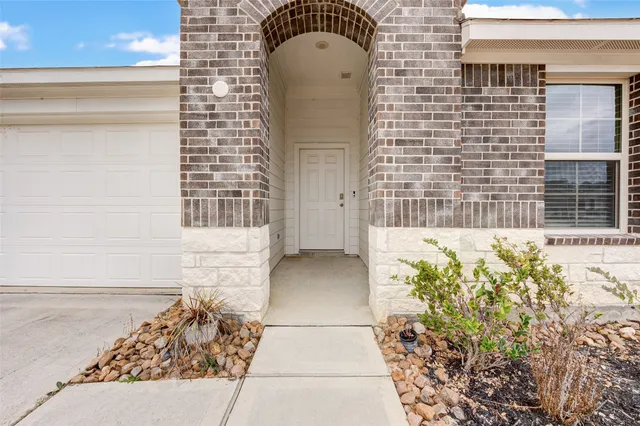 a front view of a house with a garage