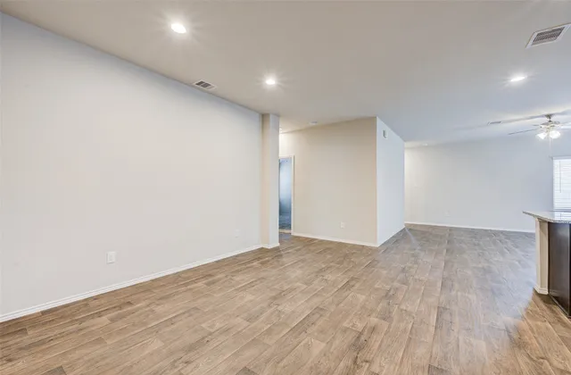 a view of kitchen with microwave and cabinets