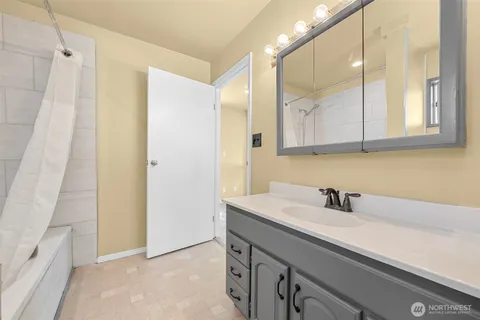 a bathroom with a sink and a mirror