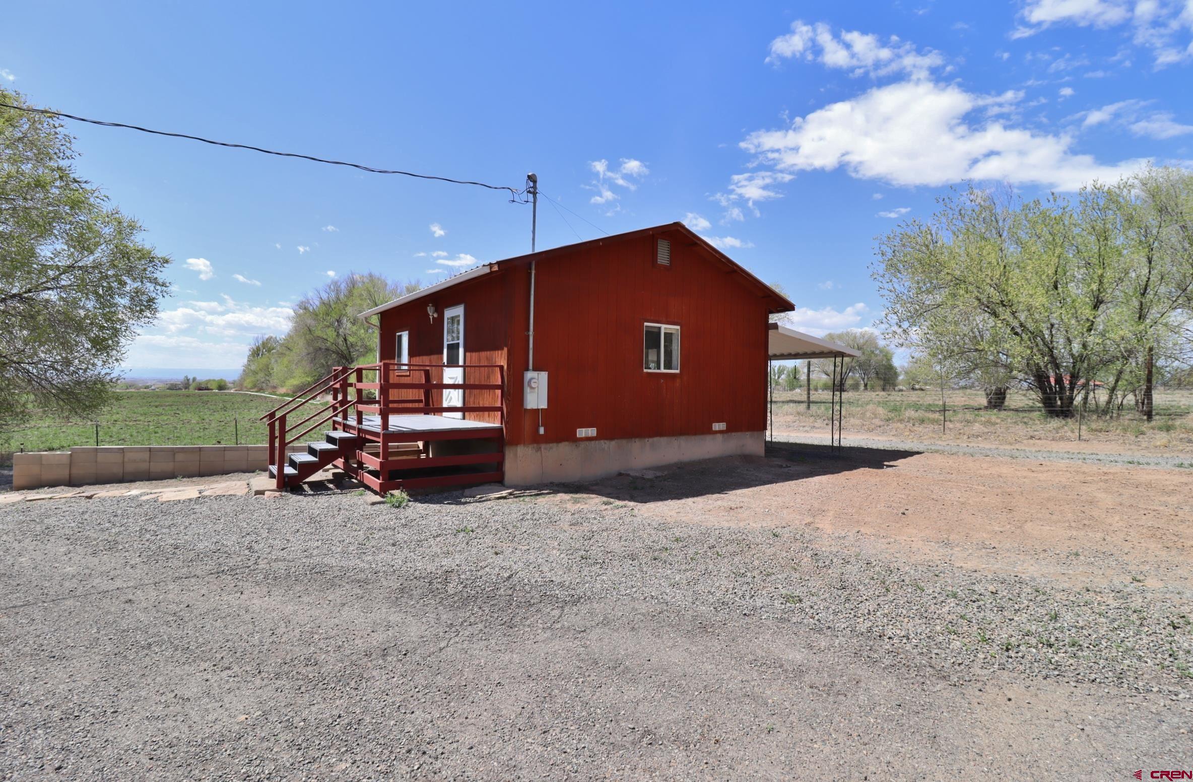 21274 Knight Road Austin, CO 81410 - Photo 18 of 35 a view of a house with a patio