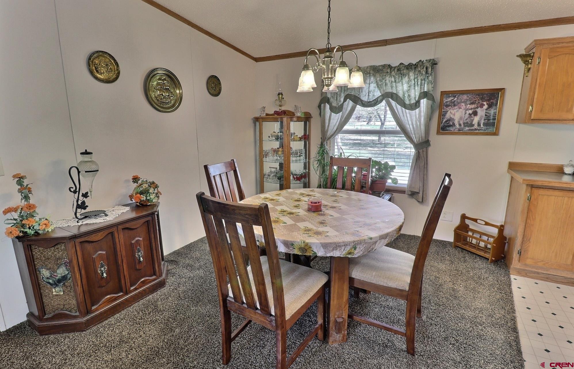 21274 Knight Road Austin, CO 81410 - Photo 5 of 35 a view of a dining room with furniture and window