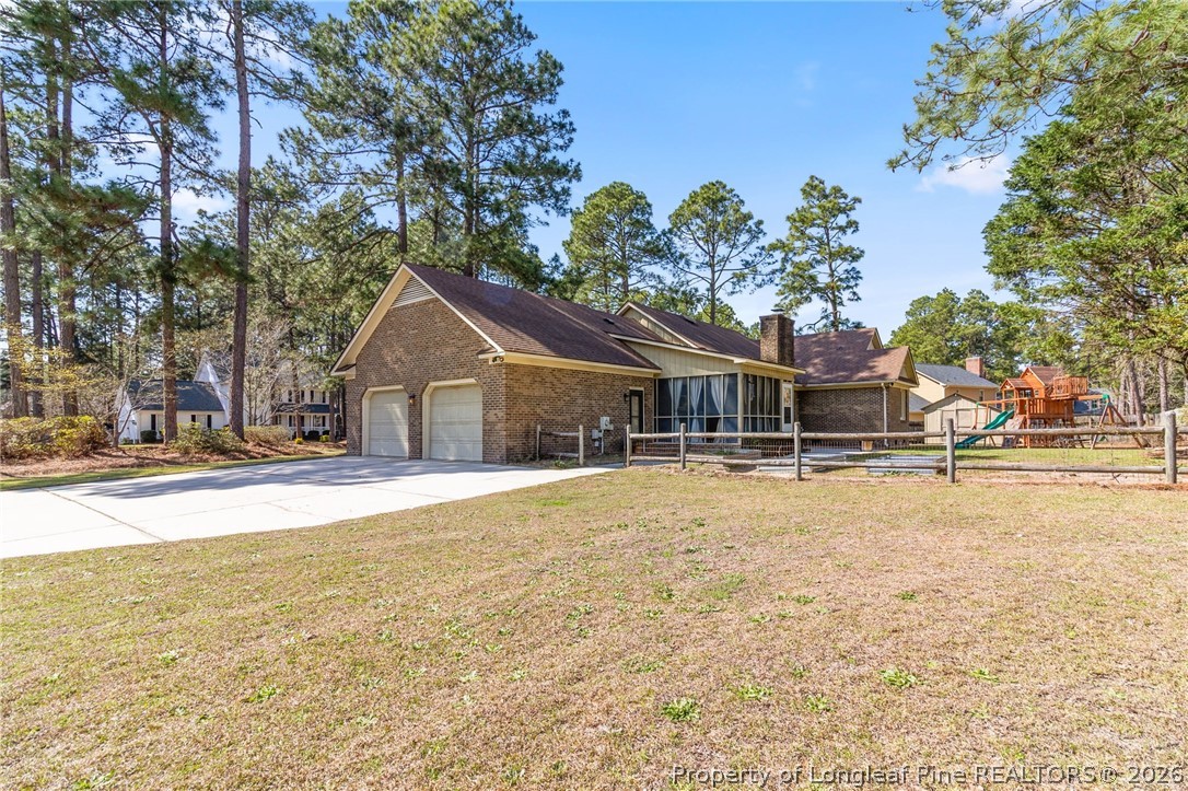 7756 Dragonhead Road Fayetteville, NC 28311 - Photo 42 of 42 a house with trees in the background