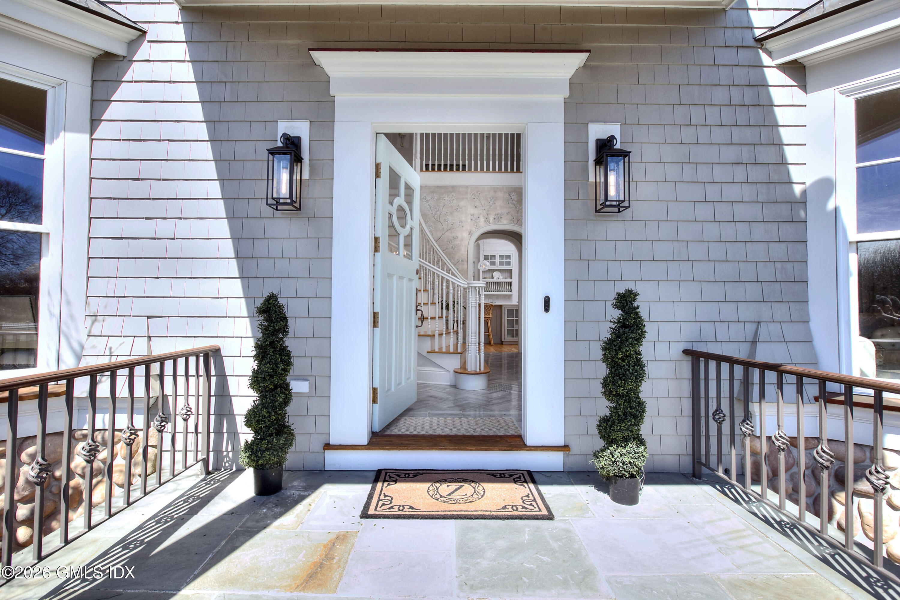 3 Shorehaven Road Norwalk, CT 06855 - Photo 4 of 40 a front view of a house with a yard