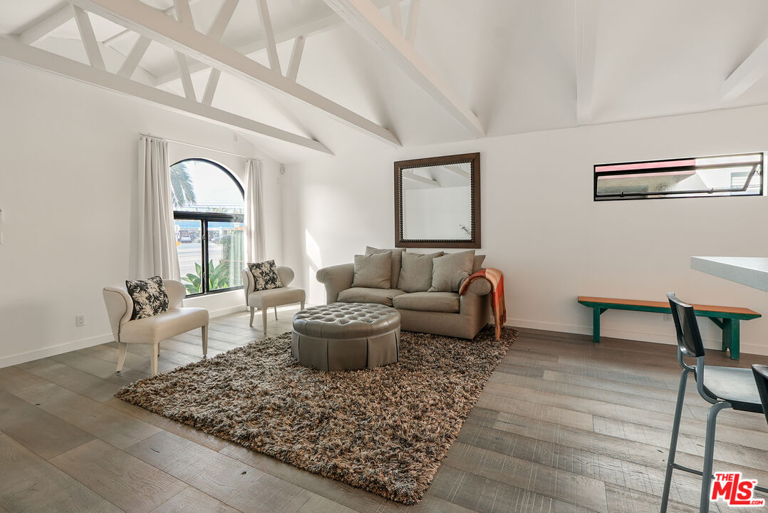 754 Washington Boulevard Marina del Rey, CA 90292 - Photo 3 of 14 a living room with furniture and a rug