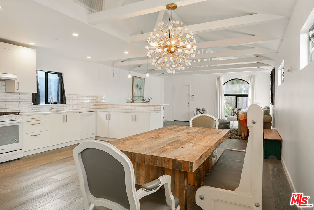 754 Washington Boulevard Marina del Rey, CA 90292 - Photo 7 of 14 a view of a dining room with furniture and chandelier