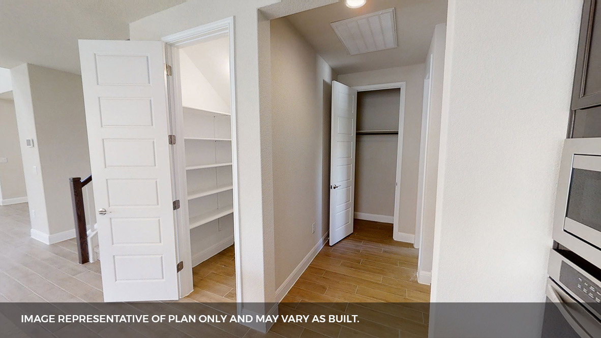 516 Prairie Wind Drive Leander, TX 78641 - Photo 14 of 40 a view of a hallway with wooden floor and staircase