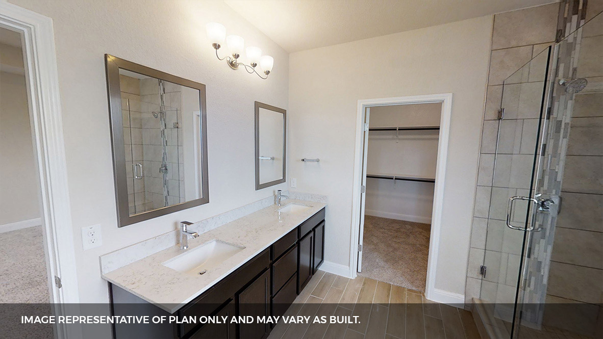 516 Prairie Wind Drive Leander, TX 78641 - Photo 17 of 40 a bathroom with a sink and a mirror