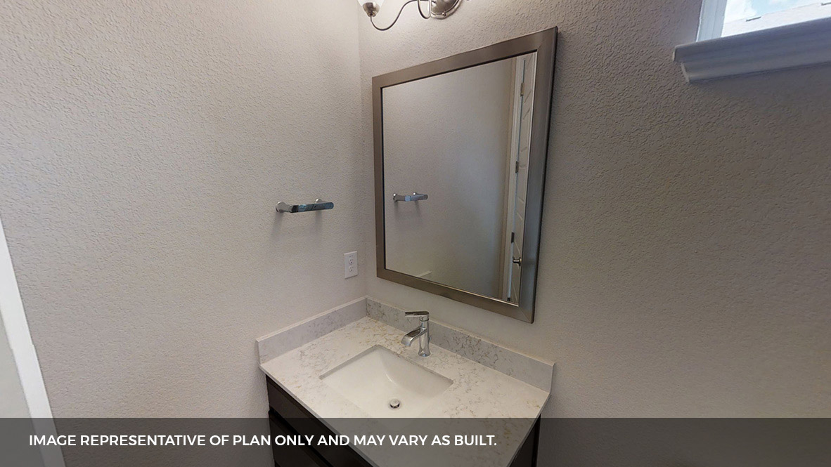 516 Prairie Wind Drive Leander, TX 78641 - Photo 30 of 40 a bathroom with a sink and a mirror