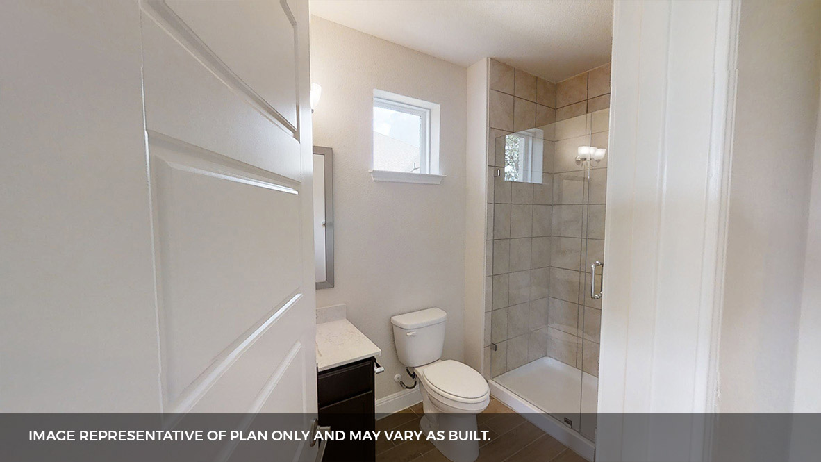 516 Prairie Wind Drive Leander, TX 78641 - Photo 31 of 40 a bathroom with a toilet and a shower