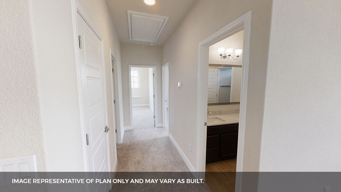 516 Prairie Wind Drive Leander, TX 78641 - Photo 33 of 40 a view of a hallway with wooden floor and staircase