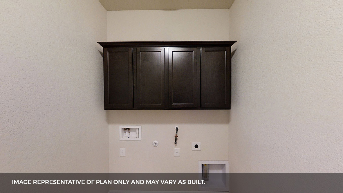 516 Prairie Wind Drive Leander, TX 78641 - Photo 34 of 40 a view of wooden cabinets