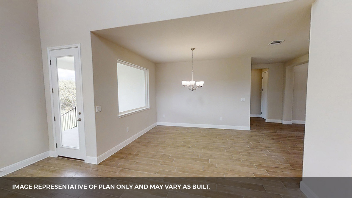516 Prairie Wind Drive Leander, TX 78641 - Photo 7 of 40 an empty room with wooden floor and windows