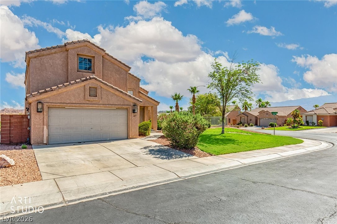 387 Silver Road Mesquite, NV 89027 - Photo 44 of 46 Stucco exterior and a tile roof define this two-story corner lot home with a driveway.
