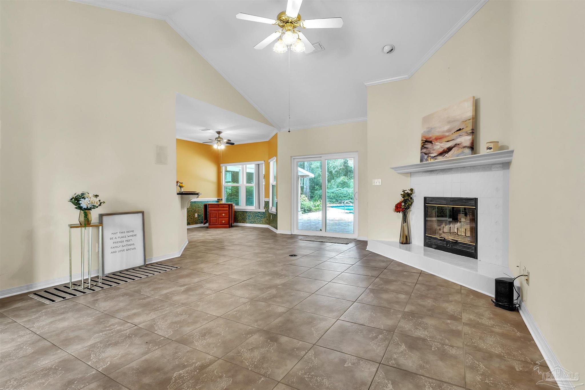 11705 Cabot Street Cantonment, FL 32533 - Photo 12 of 36 a view of a livingroom with a fireplace and window