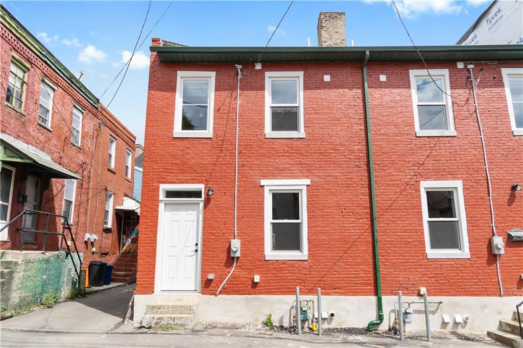 a front view of a building with a street