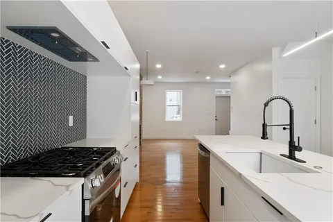 a kitchen with a sink and cabinets