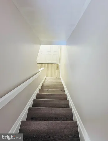 wooden floor fireplace and natural light in room