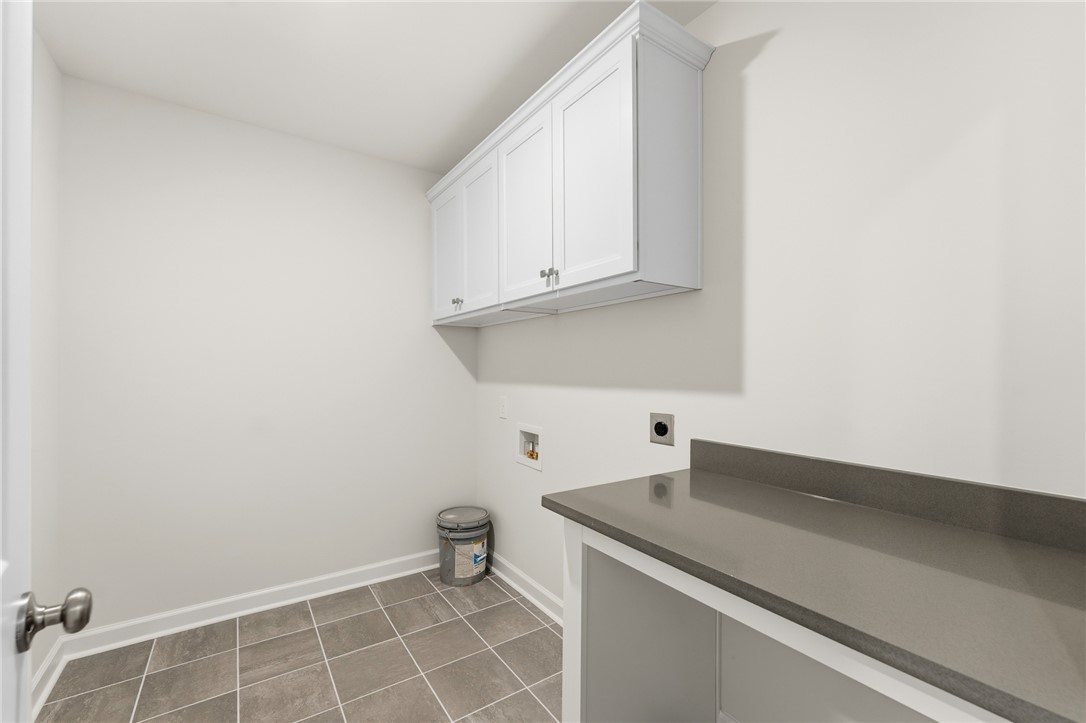 1108 Manse Jolly Road Anderson, SC 29621 - Photo 30 of 45 This functional laundry area features ample storage and counter space, perfect for everyday tasks.