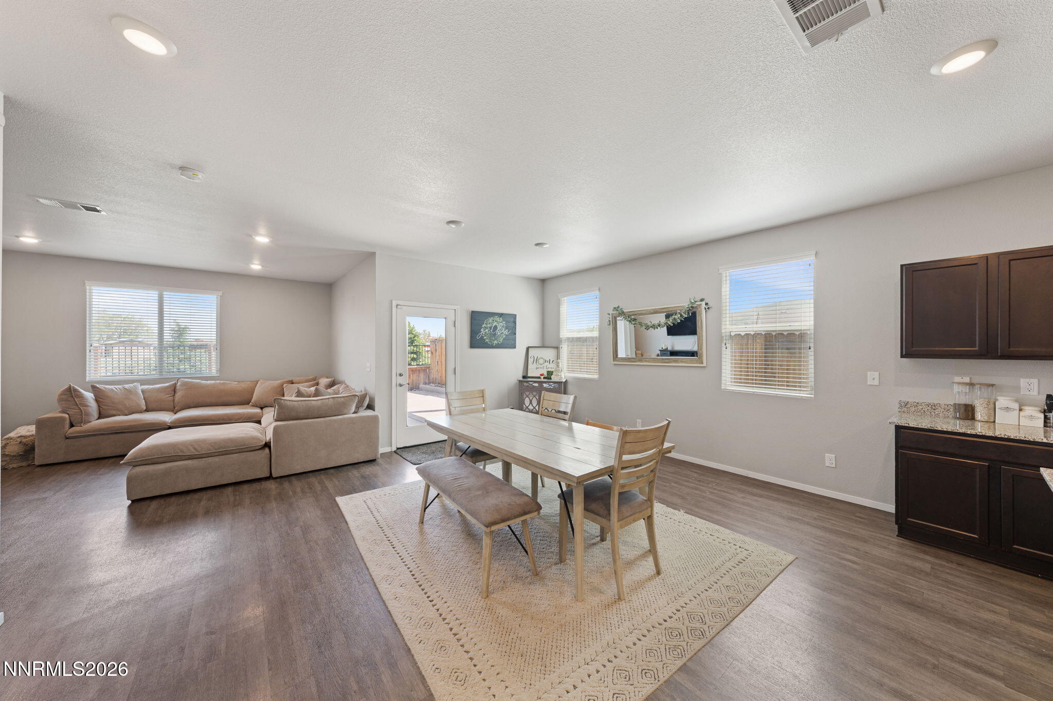 9708 Sea Glass Drive Reno, NV 89506 - Photo 30 of 51 a living room with furniture flat screen tv and wooden floor