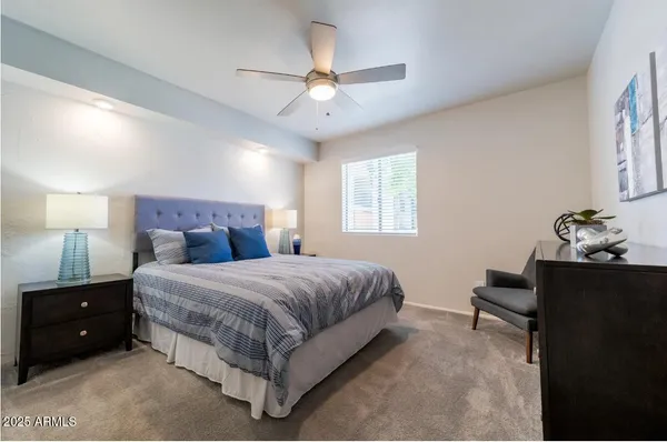 a bedroom with a bed and window