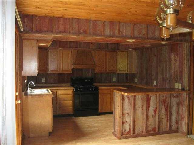 2387 Lancaster Heights Road Freeport, IL 61032 - Photo 3 of 9 a kitchen with a stove and a cabinets
