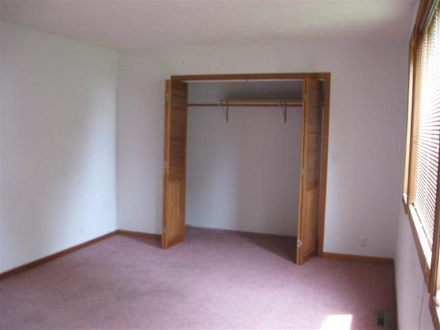 2387 Lancaster Heights Road Freeport, IL 61032 - Photo 6 of 9 an empty room with windows and closet