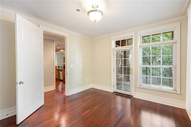 a front view of a house with a large window