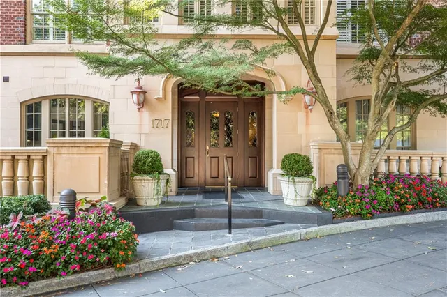 a front view of a house with flowers