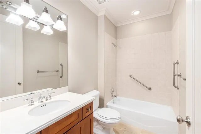 a view of a hallway with wooden floor and windows