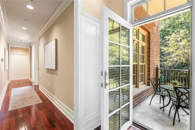 a view of a balcony with a table and chairs