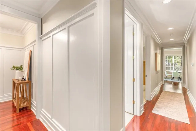 a view of hallway with stairs and wooden floor