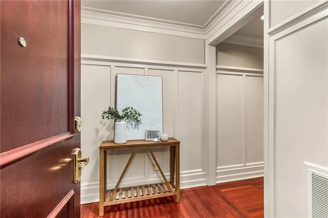 a dining room with a table and a potted plant