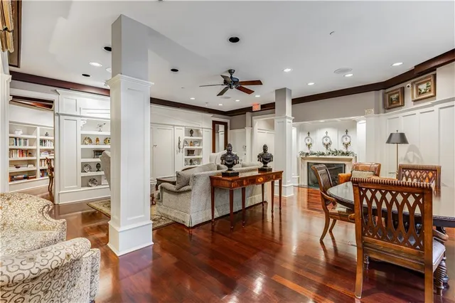 a view of a dining room with furniture and a book shelf