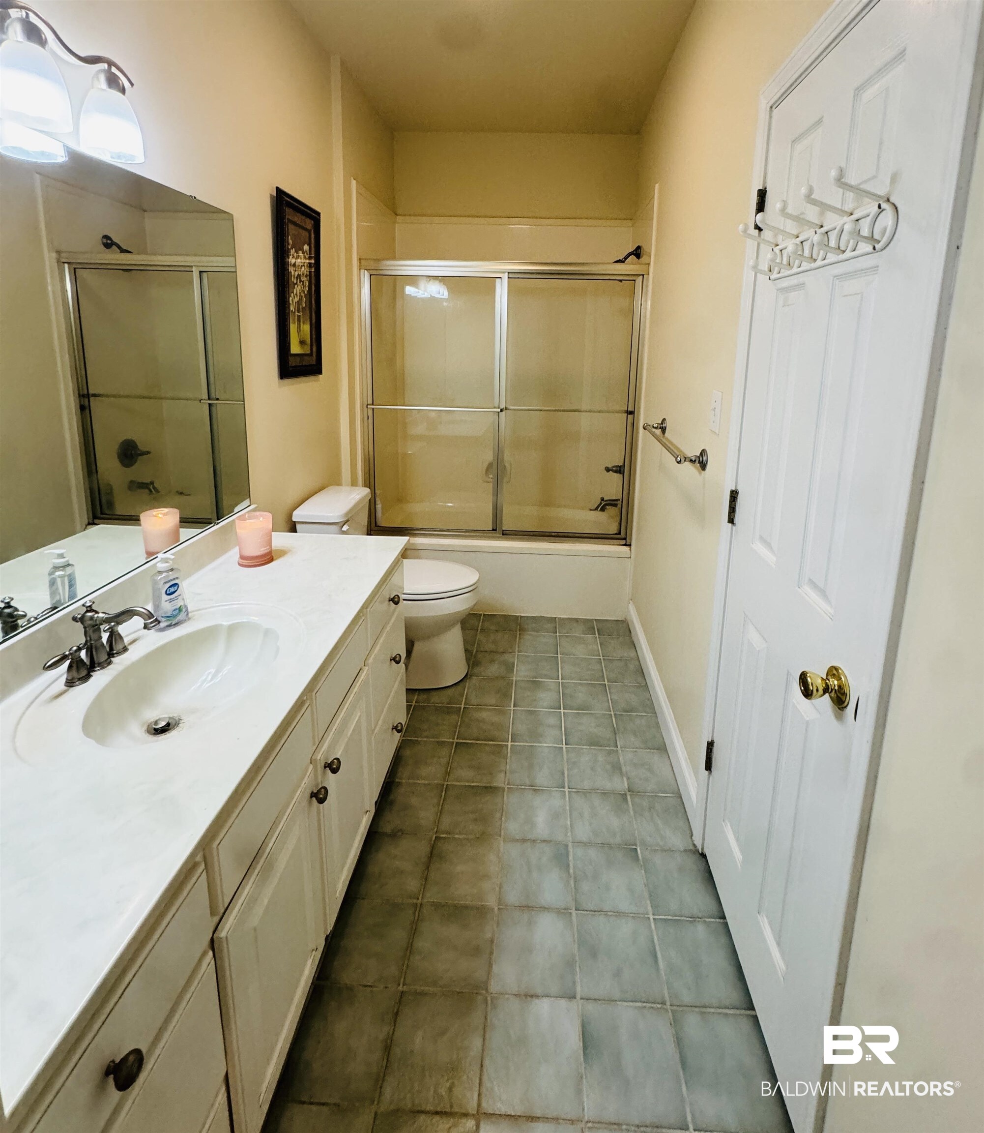 13795 White Road Silverhill, AL 36576 - Photo 47 of 99 Bathroom featuring vanity, bath / shower combo with glass door, and light tile patterned floors