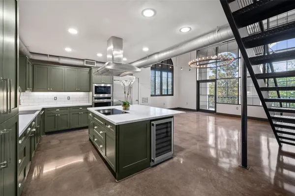 a kitchen that has a lot of cabinets in it