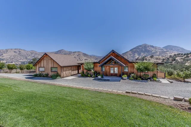 front view of a house with a yard