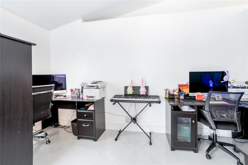 Undisclosed Address Spring Hill, FL 34609 - Photo 26 of 32 a view of a workspace with furniture