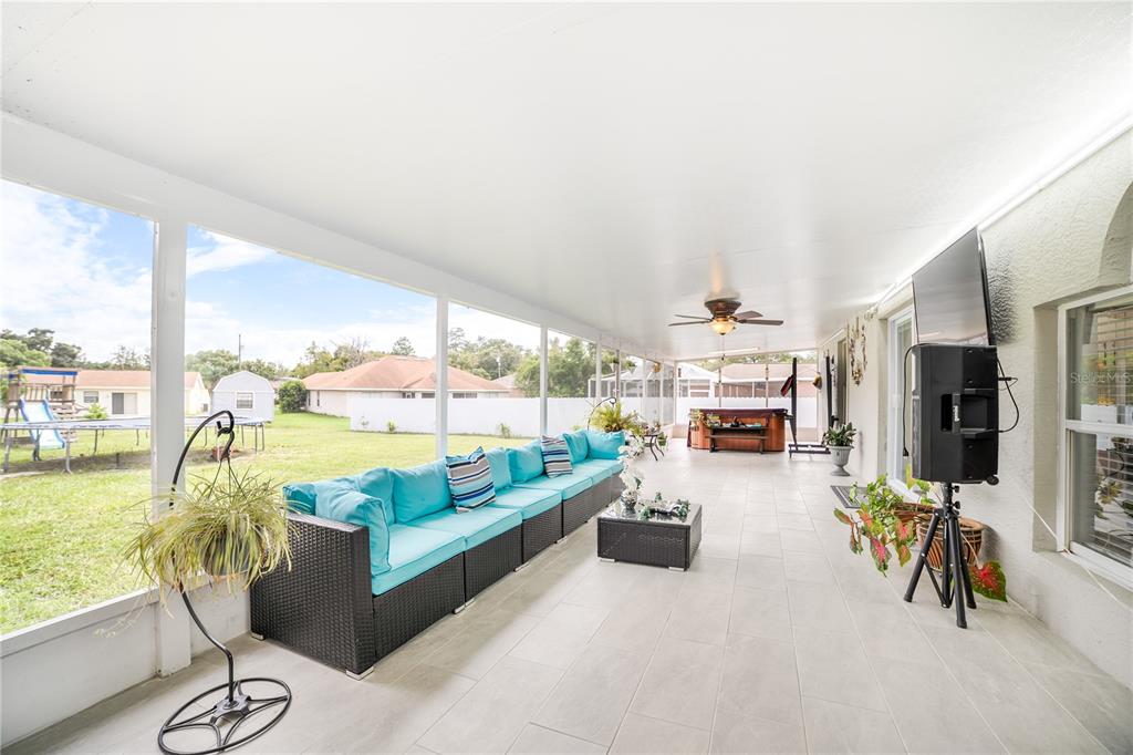 Undisclosed Address Spring Hill, FL 34609 - Photo 27 of 32 a living room with furniture and a large window