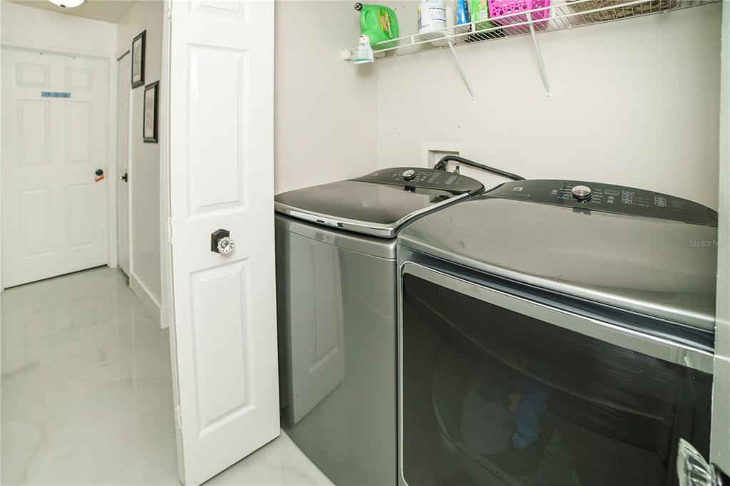 Undisclosed Address Spring Hill, FL 34609 - Photo 29 of 32 a utility room with dryer and washer