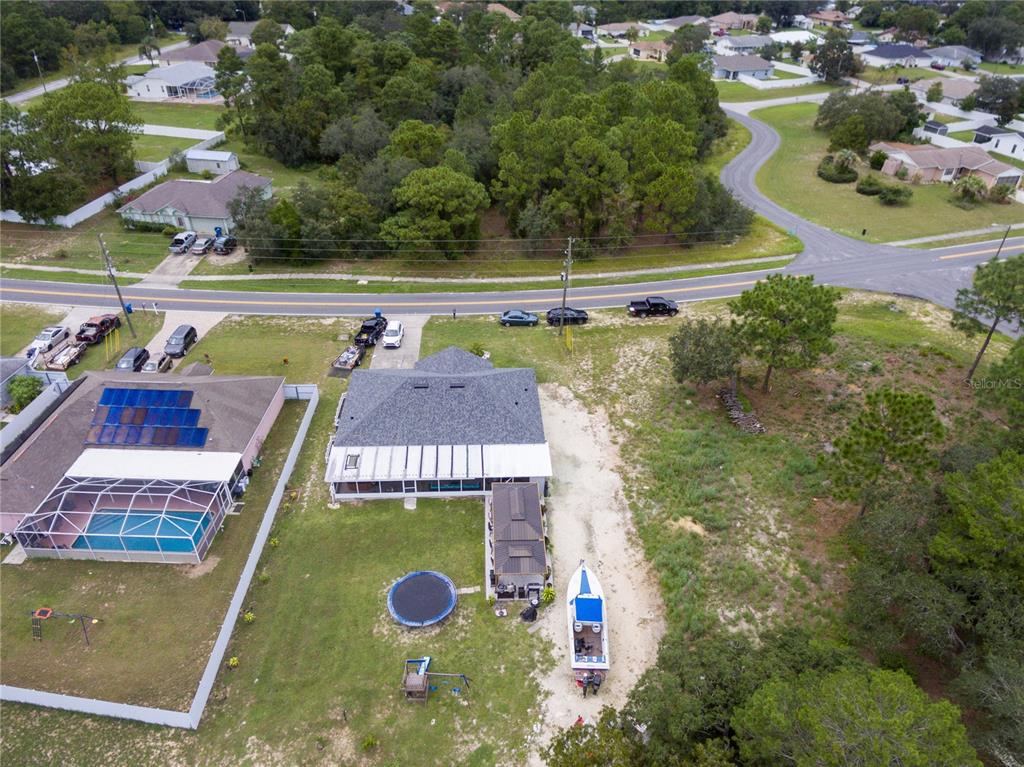 Undisclosed Address Spring Hill, FL 34609 - Photo 7 of 32 an aerial view of swimming pool with outdoor space