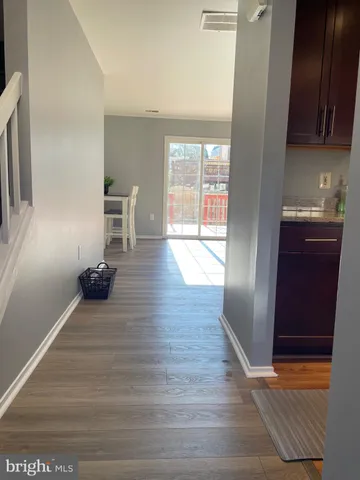 a view of a livingroom with wooden floor