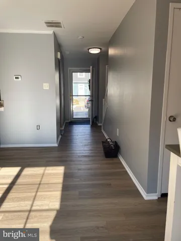 a view of entryway with wooden floor