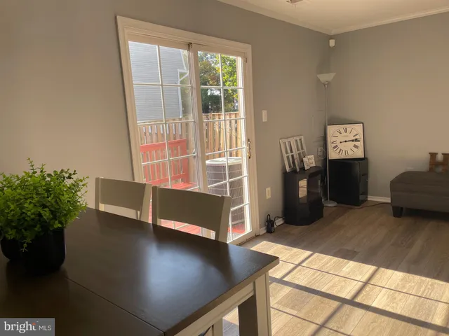 a view of a livingroom with furniture and a potted plant