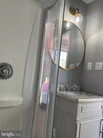 a bathroom with a sink and a mirror
