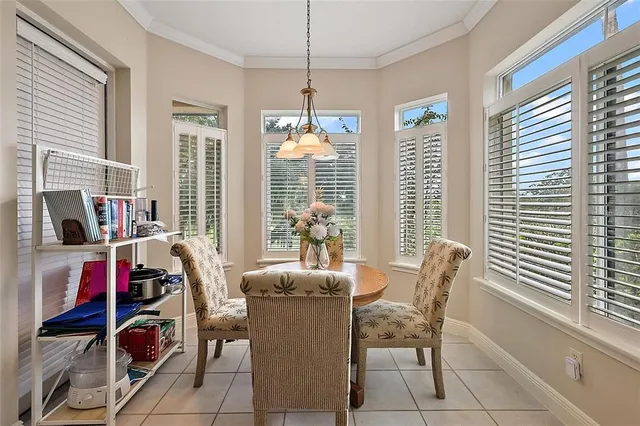 a view of a dining room with furniture and windows