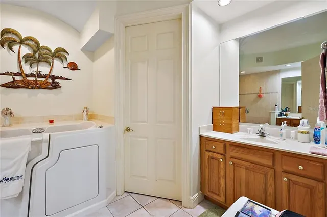 a utility room with cabinets washer and dryer
